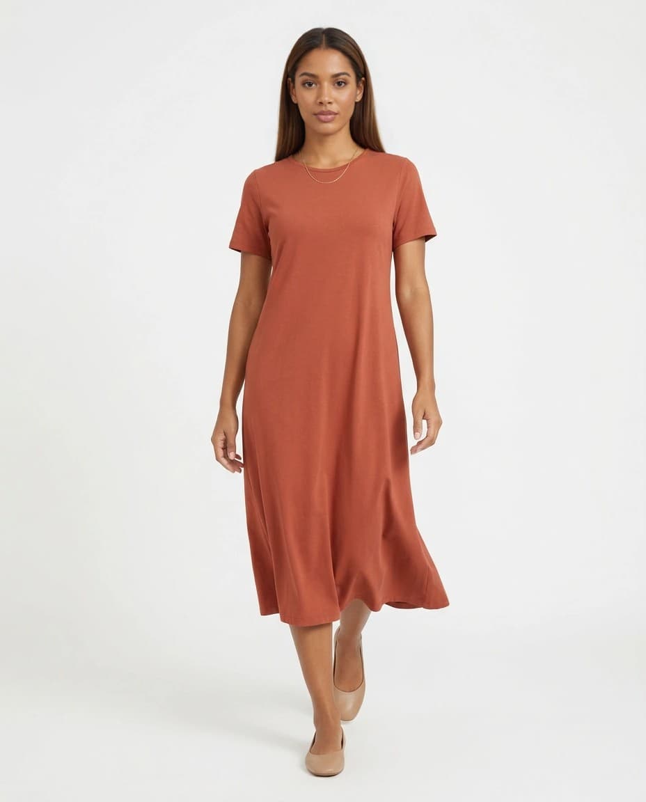 Modelo sintética adulta com vestido midi terracota em estúdio claro